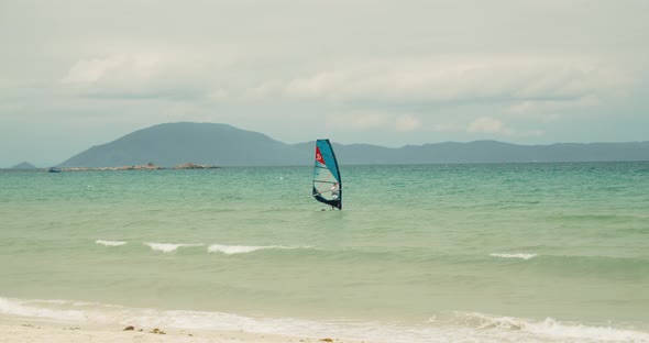 View of the City Beach and Active People Practicing Kite Surfing and Windsurfing