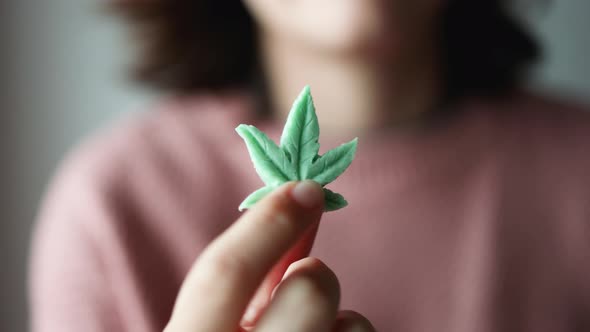 Cbd Candy  Woman Holding Edible Cannabis Leaf for Anxiety Treatment  Marijuana Alternative Medicine