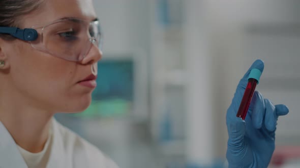 Microbiologist Analyzing Dna Substance in Test Tube