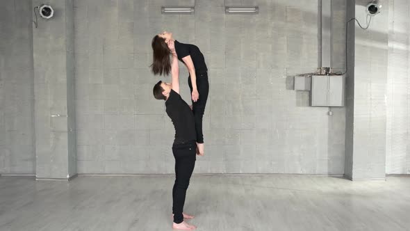 Young Handsome Dancer Lifting Up His Female Partner