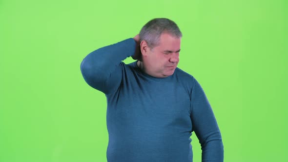 Headache Torments Middle Aged Man. Green Screen