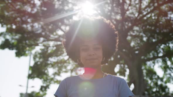 Front view of mixed race woman in park