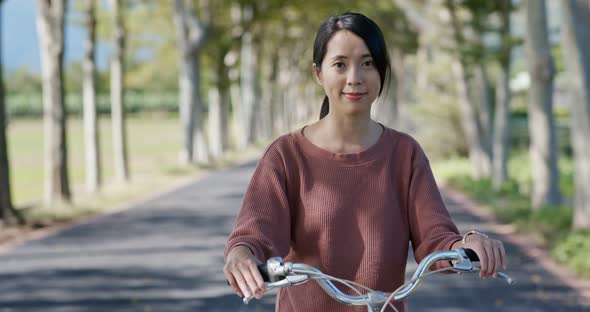Woman ride a bike in countryside