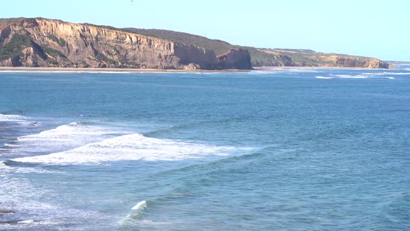 Surfers Paradise at Bells Beach Torquay Victoria South Pacific with waves hitting the shore and rock