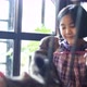 Lovely Asian girl feeding group of kitten cat with cat food. - VideoHive Item for Sale