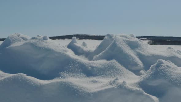 Large Drifts Of Snow On The Background Of Mountains