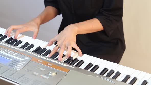 Girl Playing On Electric Piano