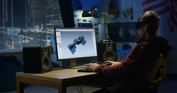 Man Designing Hinge on a Computer