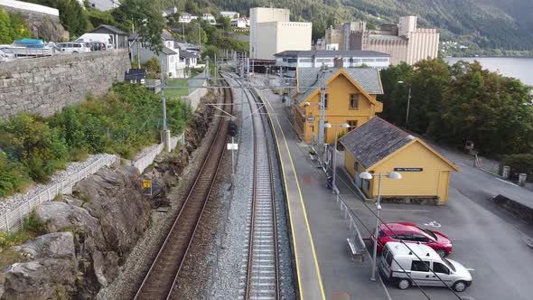 Aerial Flying above railway at Vaksdal train station - Bergen Railroad