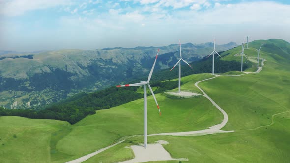 Green Meadow with Wind Turbines Generating Electricity