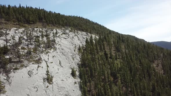 Aerial Footage Flying Up The Side Of A Mountain