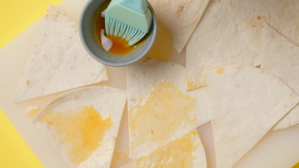 Vertical Flat Lay Video Chef Smears Nachos By Brush in the Hot Mexican Sauce