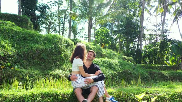 Thailand, Asia, romance in the jungle. young couple kissing and hugging in the tropical forest with