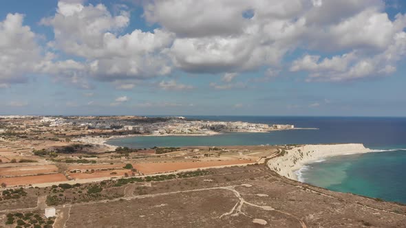 Aerial drone video from eastern Malta, Marsaxlokk area, Il-Hofra l-Kbira bay.