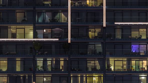 Flat Night Panorama of Multicolor Light in Windows of Multistory Buildings Aerial Timelapse