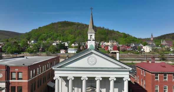 Church in Cumberland Maryland. Historic low income town in Western Maryland, USA. Rising aerial.