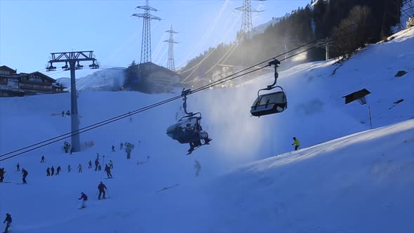 Snow-making machines a snow covered mountain resort.