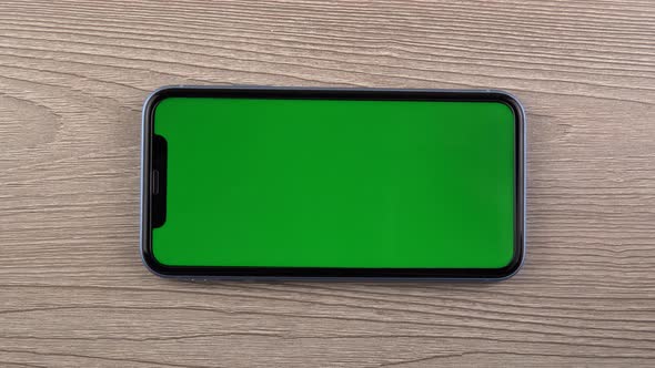 Smartphone with Green Screen Mockup Swipe Scroll Hand Close Up Mobile Phone User