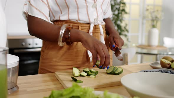 Female Hands Cutting Vegetables