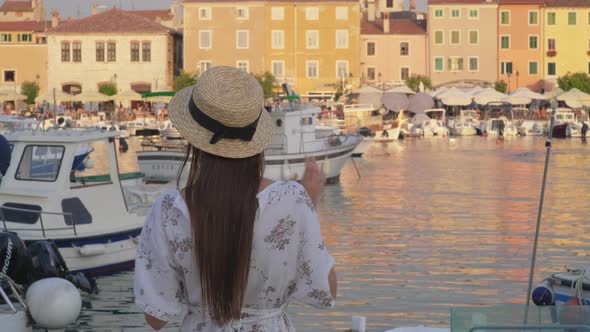 Lady in Rovinj Quay at Sunset Croatia