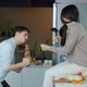 Slow Motion of Joyful Millennials Boyfriend and Girlfriend Singing and Dancing in Kitchen at Home - VideoHive Item for Sale