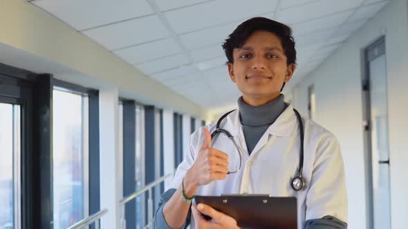 Friendly Happy Indian Male Physician or Intern Professional General Practitioner Posing with