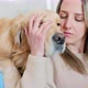 Woman stoking and kissing golden retriever, Milan, Italy - VideoHive Item for Sale