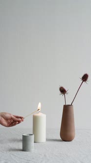 Hand Lighting Candle