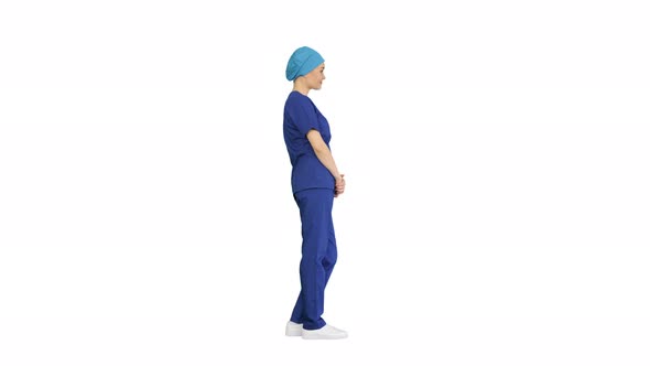 Female Nurse or Surgeon Wearing Blue Suit Standing and Waiting on White Background