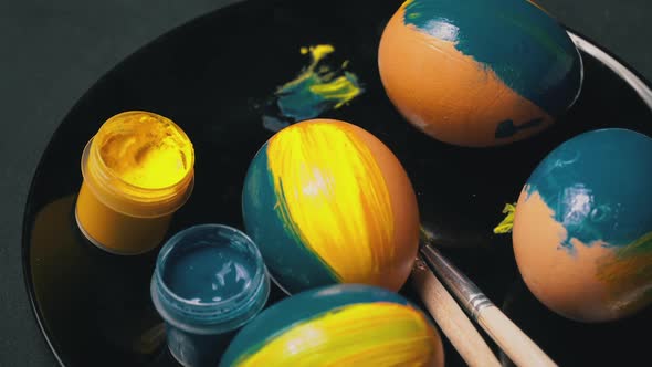 Painted YellowBlue Easter Eggs are Spinning