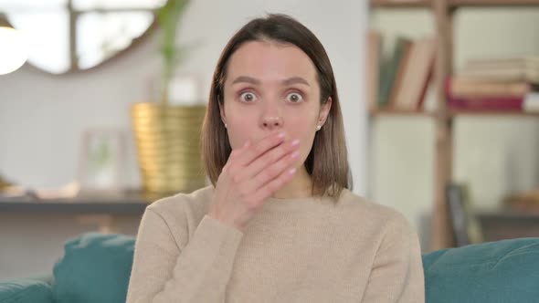 Portrait of Young Woman Feeling Shocked at Home