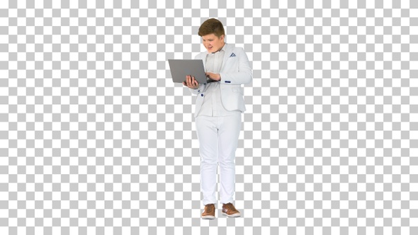 Caucasian boy in a suit working on laptop, Alpha Channel