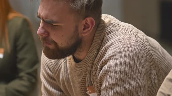 Emotional Man with Depression at Therapy Session