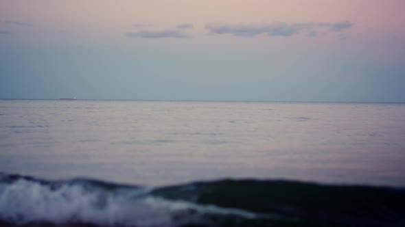 Calm Ocean Surface Horizon at Pink Sky in Cold Morning Dawn
