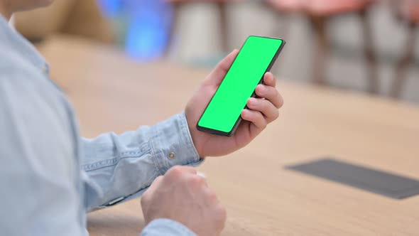 Man Using Smartphone with Green Chroma Key Screen