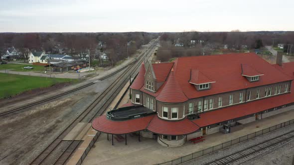 Durand, Michigan antique train depot with drone videoing sideways.