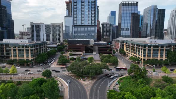 Rising aerial shot of traffic in Austin, Texas. Urban planning and southern city theme. Skyscrapers