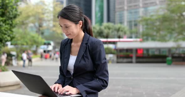 Businesswoman work on laptop computer at outdoor