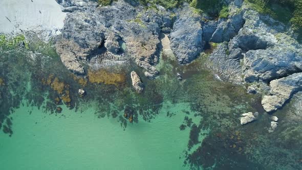 Top down aerial view of beautiful calm ocean off Cornwall, UK