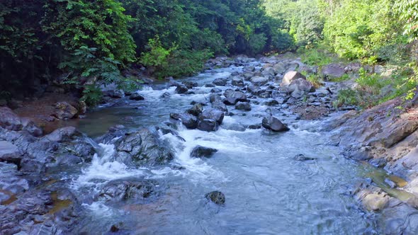 Rocky Forest River During Summer, Rio Higuero In Dominican Republic - aerial drone shot