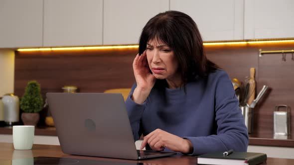 Desperate Businesswoman Uses Laptop Reviews Company Sales Report Feeling Worried
