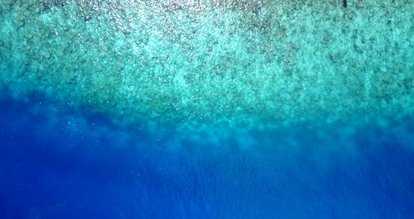 Natural flying copy space shot of a summer white paradise sand beach and blue water background