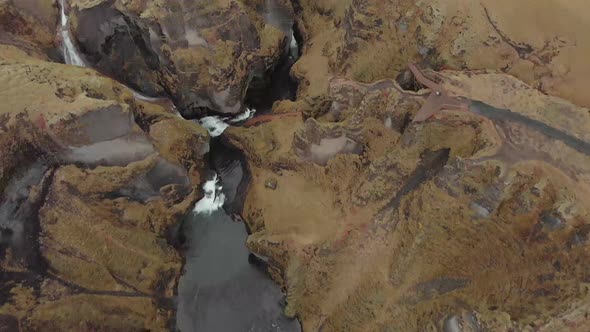 Cinematic aerial flyover of stunning Icelandic canyon.