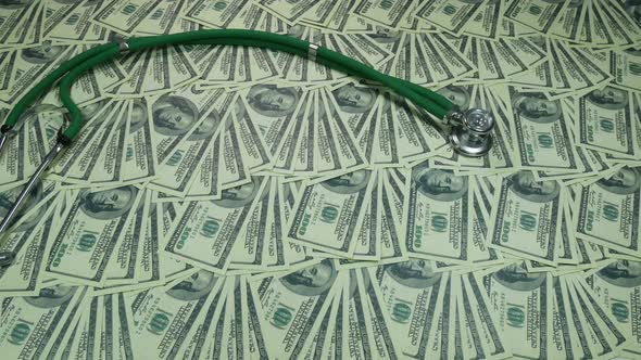 American Dollars And A Stethoscope Lie On A Table