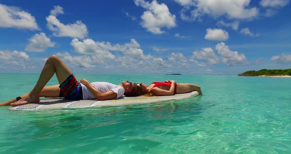 Happy people in love dating on vacation have fun on beach on summer white sandy 4K background