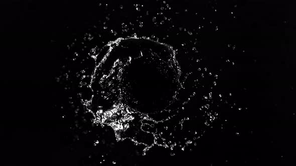 Super Slow Motion Shot of Rotating Water Splash Isolated on Black Background at 1000Fps