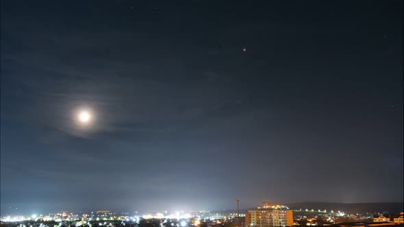 Moonrise time-lapse footage above city