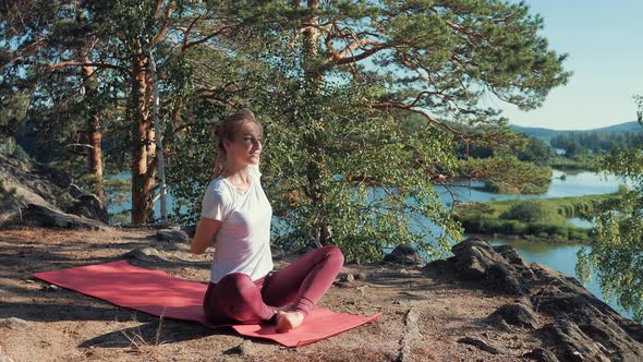 Yoga Teacher Shows the Correct Performance of a Cow Pose. Gomukhasana.