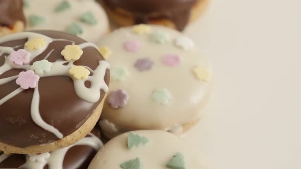 Tasty looking cookies with sprinkles 4K 2160p 30fps UltraHD footage -  Stuffed teacakes on pile shal