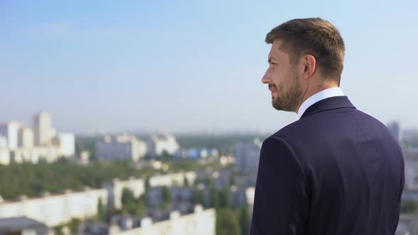 Happy Male Employee in Suit Looking at City Outdoors Office, Work Inspiration